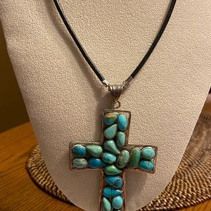 Artisan Jewelry - Turquoise stone cross shaped pendant on leather Artisan Jewelry - Turquoise stone cross shaped pendant on leather